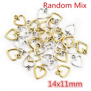 Macro view of 14x11mm hollow heart charms in gold and silver for DIY jewelry