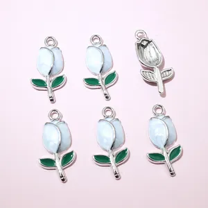 Detail view of six tulip flower pendants for DIY jewelry with glossy enamel finish