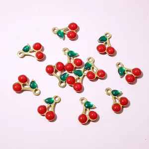 Set of 10 red cherry charms with gold plating and green leaves for DIY jewelry making