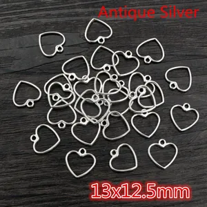 Macro shot of 13x12.5mm antique silver hollow heart charms for DIY jewelry making