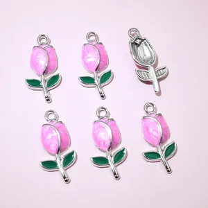 Macro detail of tulip flower charms with pink pearlescent petals for DIY jewelry making