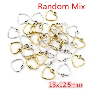 Macro shot of 13x12.5mm alloy hollow heart charms in gold and silver mix for DIY jewelry