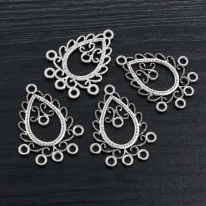 Vintage silver teardrop hollow alloy pendants with intricate retro filigree patterns