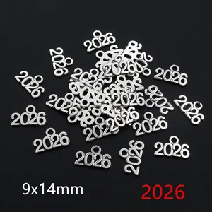 Macro shot showing 9x14mm antique silver 2026 graduation cap pendants for DIY jewelry