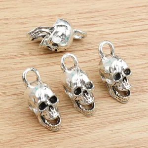 Set of four vintage antique silver skull pendants for DIY necklace and bracelet jewelry