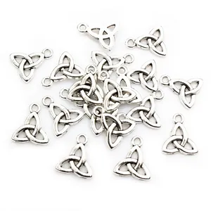 Macro view of antique silver triquetra celtic knot charms for jewelry making DIY