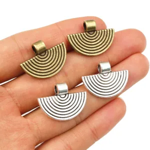 Set of 4 fan-shaped alloy pendants for DIY jewelry making in bronze and silver finishes