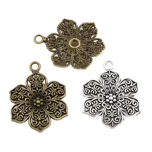 Hollow flower alloy pendants in bronze, gold, and silver finishes for DIY jewelry making