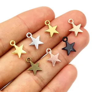 Star-shaped alloy charms for DIY jewelry making in various metallic colors held in hand