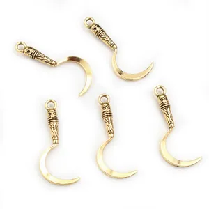 Five pieces of gothic skull alloy scythe charms in antique gold for DIY jewelry making