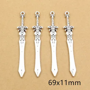 Detail of four vintage silver sword alloy pendants measuring 69x11mm for DIY jewelry
