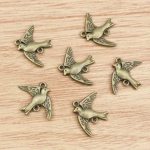Vintage bronze swallow bird charms for DIY jewelry making with dual connector rings