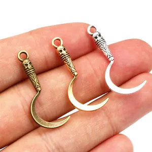 Gothic reaper scythe pendants in bronze, gold, and silver finishes for DIY jewelry making
