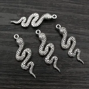Set of four antique silver snake charms with scale texture for DIY jewelry making