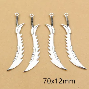 Detailed view of four antique silver sword charms measuring 70x12mm for DIY jewelry