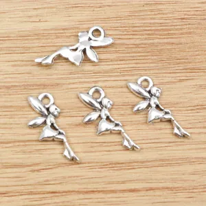 Set of four antique silver fairy elf charms for DIY jewelry making on wood background