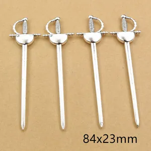 Detail view of four antique silver alloy sword charms measuring 84x23mm for DIY jewelry