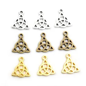 Macro view of Celtic Trinity knot charms in silver, antique bronze, and gold finishes