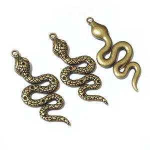 Three antique bronze snake pendants for DIY jewelry making and necklace crafts