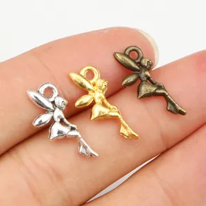 Three-color alloy fairy charms for DIY jewelry making shown on fingertips