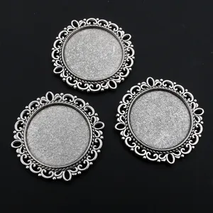 Three antique silver 25mm alloy pendant trays with vintage hollow pattern for DIY jewelry