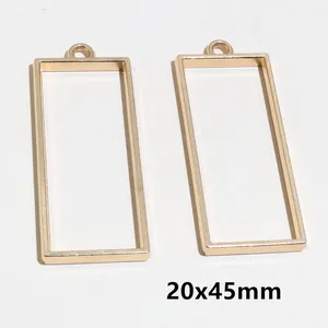 Paire de pendentifs cadres rectangulaires dorés 20x45mm pour création de bijoux DIY et résine