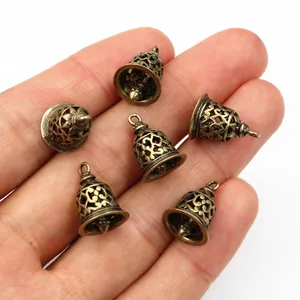 Detailed macro of six 3D antique bronze hollow bells for DIY jewelry making