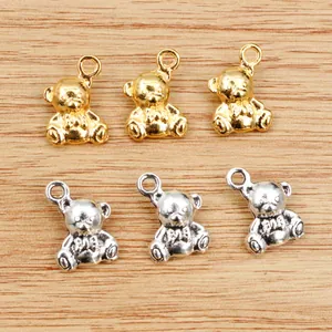 Detail of 3D bear alloy pendants in gold and silver finish for DIY jewelry making