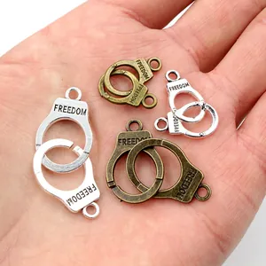 Alloy freedom handcuffs charms in silver and bronze finish for DIY jewelry making