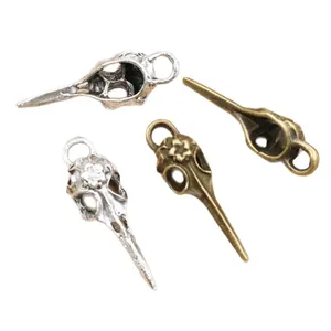 Antique silver and bronze bird skull alloy pendants with floral details for DIY jewelry