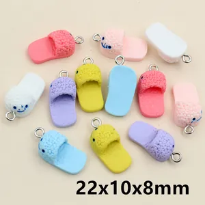 Macro detail of colorful resin shoe pendants with smiley face prints and metal rings