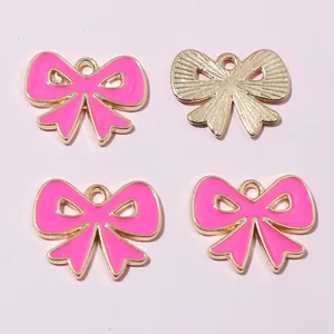 Colgantes de lazo de aleación esmaltada rosa y dorado para accesorios de joyas DIY