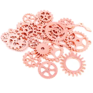 Macro shot of assorted rose gold steampunk alloy gears and clock hands for DIY jewelry