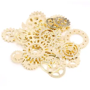Detailed close-up of mixed golden steampunk alloy gears and clock hand pendants for DIY