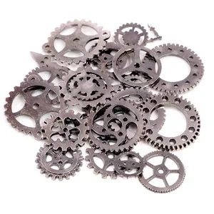 Macro shot of assorted vintage steampunk industrial alloy gears in antique silver finish
