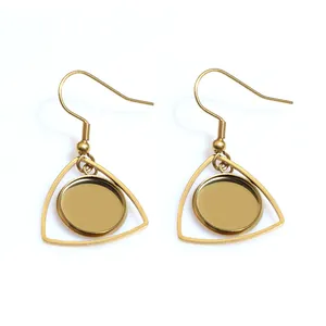 Close-up of golden stainless steel geometric triangle frames with DIY round tray bases