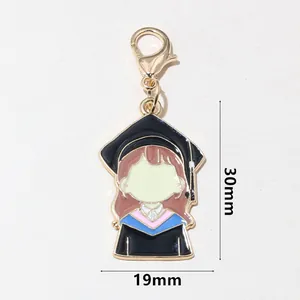 Detail view of cartoon graduation cap charm with dimensions 30mm x 19mm and lobster clasp