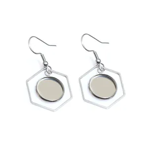 Macro shot of silver stainless steel hexagonal frame and round tray earring base
