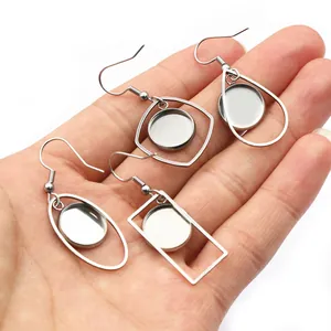Golden stainless steel geometric earring base frames in oval, diamond, and teardrop shapes