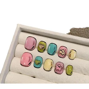 Handmade 2D pop art press-on nails set with 3D star and heart charms in bright colors