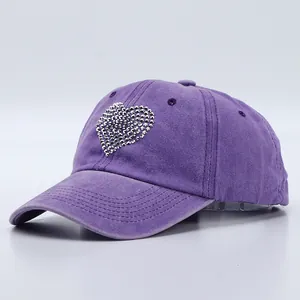 Washed purple cotton baseball cap featuring a sparkling rhinestone heart design