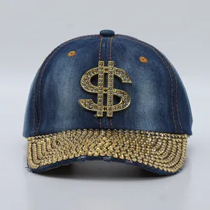 Detailed view of denim baseball cap with gold rhinestone dollar sign and studded brim