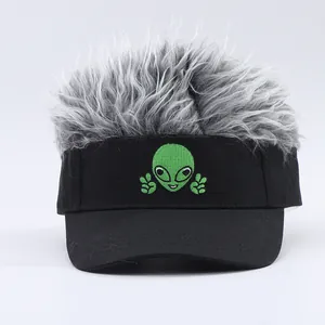 Detail of funny baseball cap with gray synthetic hair wig and alien embroidery