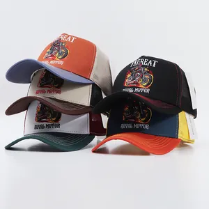 Detail of vintage trucker caps with motorcycle embroidery and breathable mesh back