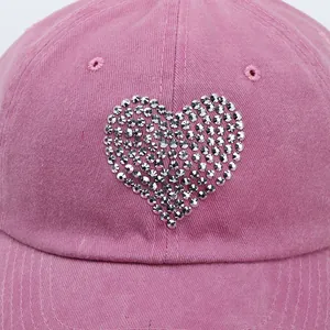 Pink washed cotton baseball cap with a sparkling rhinestone heart design for women