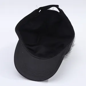 Inside view of black alien baseball cap showing interior lining and wig attachment detail