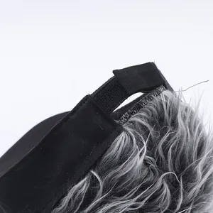 Detail of adjustable hook-and-loop strap and gray synthetic hair on alien wig baseball cap