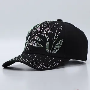 Detailed close-up of sparkling colorful rhinestones on a black cotton baseball cap