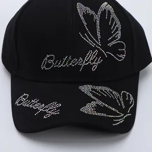Black cotton baseball cap with butterfly rhinestone patterns and sparkling studs