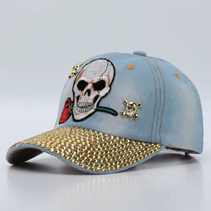 Denim skull baseball cap with red rose embroidery and rhinestone brim accents
